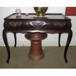 An oriental hall table with three drawers on cabriole legs
