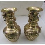 A pair of oriental brass vases.