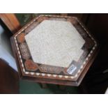 An Eastern octagonal inlaid occasional table.