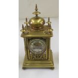 A 19th Century brass clock with enamel chapter ring.