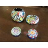 A small millefiori glass bowl, two small millefiori paperweights and a Murano glass vase