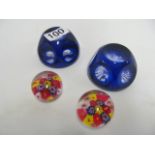 Two blue faceted glass paperweights and two small Millifiori paperweights