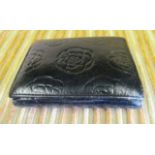 A ladies black leather purse by Chanel