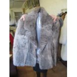 A grey Coney fur coat.