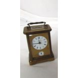 A 19th century brass Carriage clock with circular enamel dial and alarm dial