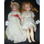 An old Armand Marseille bisque head doll with rolling eyes and open mouth and composite body, in