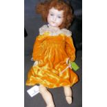 An old Armand Marseille bisque head doll with rolling eyes and open mouth, having composite body,