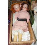 Two old German bisque head dolls with composite bodies, in original vintage clothing, in doll’s