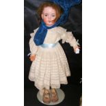 An old large German bisque head doll with blue glass eyes and open mouth, composite body - stamped