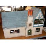 A 1930’s “Mayflower” vintage dolls house with blue tiled roof, fitted with vintage furniture -