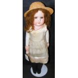An old Armand Marseille bisque head doll with cloth body and glass eyes, with impress mark 370 -