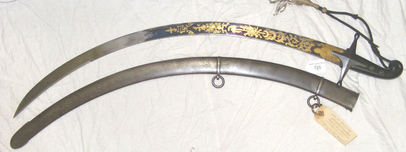 A rare Egyptian Officer’s sabre with gilt decoration to the blued 72cm blade, having ebony handle