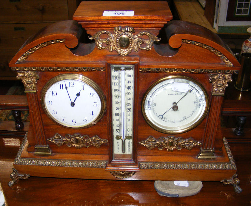 An Empire style clock barometer/thermometer with gilt mounts - 34cm wide