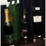 A 1975 Cockburn’s bottle of Vintage Port, together with one other and a House of Commons Champagne