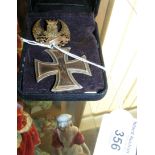 First World War German Iron Cross Medal, together with a commemorative brooch
