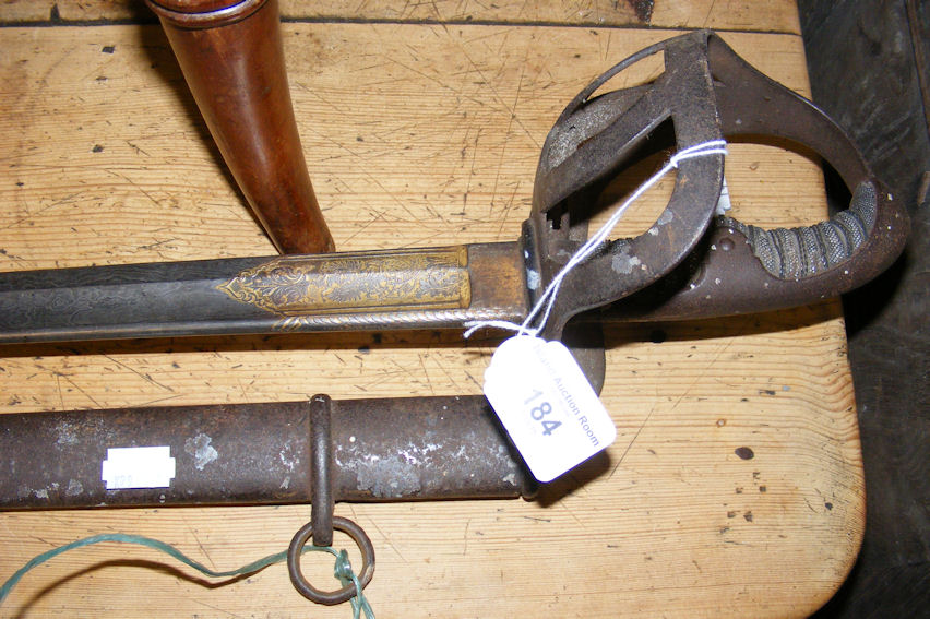 An antique curved Officer’s sword with engraved decoration to blade - 98cm long