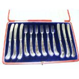 A cased set of knives & forks with sterl