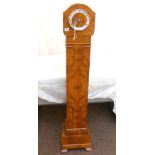 A walnut cased grand mother clock.