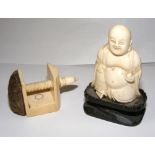 A carved ivory Buddha figurine & pin cushion.  CONDITION REPORT: Good, no chips to report.