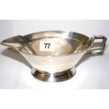 An Art Deco style sterling silver sauce boat weighing 6.8oz hallmarked for Sheffield 1933 (19cm