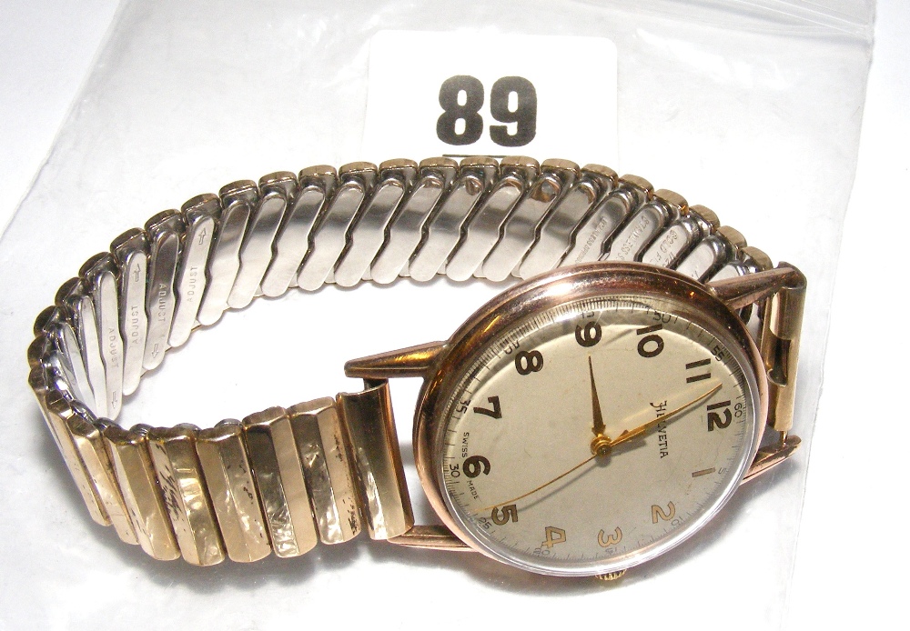 A 9ct gold "Helvetia" wristwatch. CONDITION REPORT: Winds up and ticks, the straps are rolled gold.