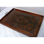 A large butlers tray, intricately carved