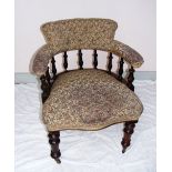 A Victorian arm chair standing on four t