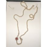 A pearl necklace with a 9ct gold & ameth