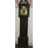 A grandfather clock with a carved case &