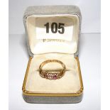 An 18ct gold ring set with two rubies &