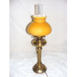 A brass oil lamp, with a chimney & yello