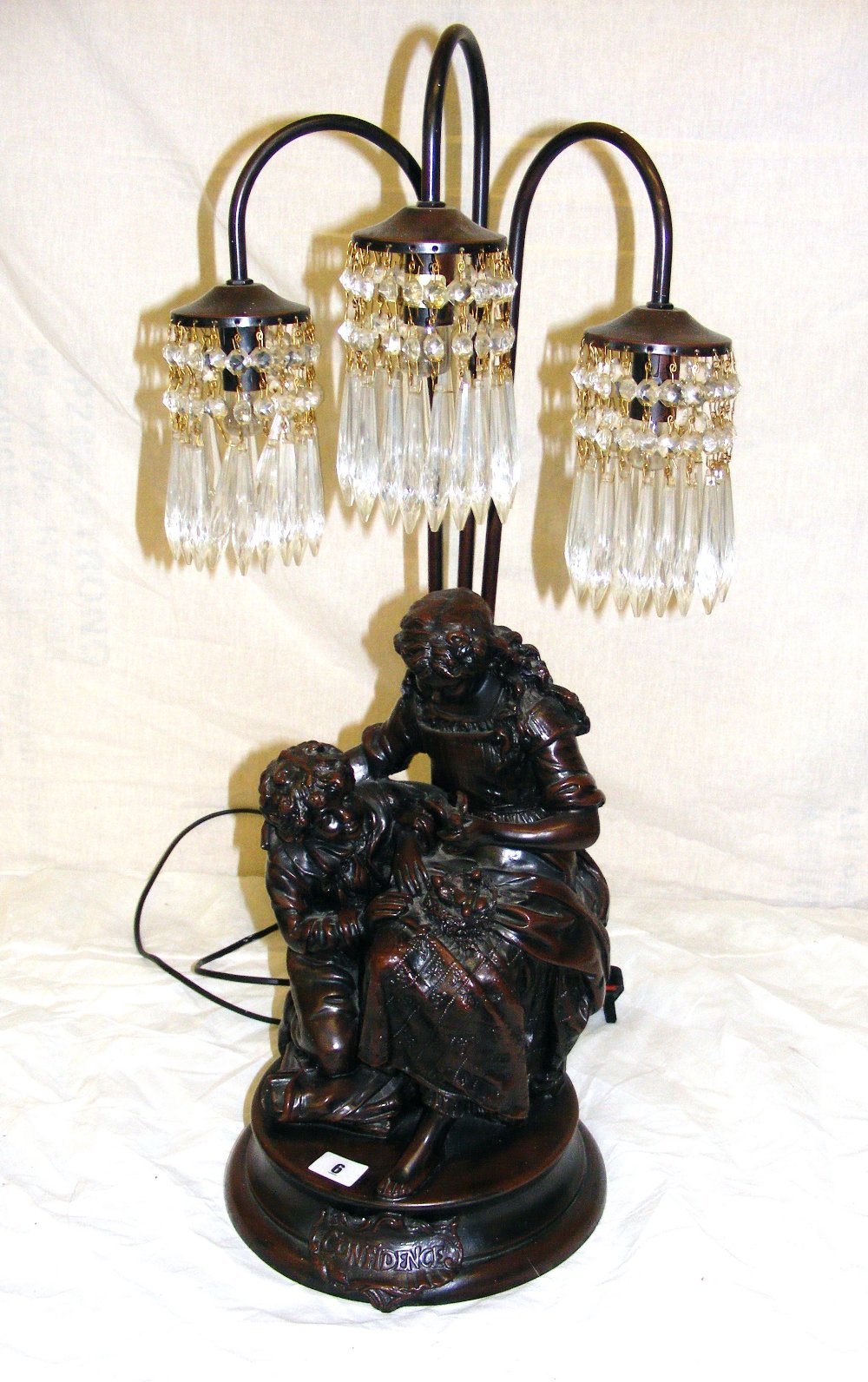 A large figural Dutch bronze lamp signed