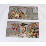 An antique pair of porcelain plaques,beautifully enameled with birds in branches & signed "W" to the