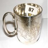 A sterling silver christening mug with a vacant cartouche & hallmarked for London, approx 3.6oz in