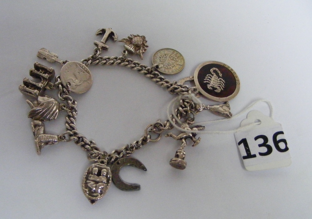 A silver charm bracelet & charms (52 gra