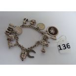 A silver charm bracelet & charms (52 gra