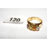 An 18ct gold ring set with four coloured