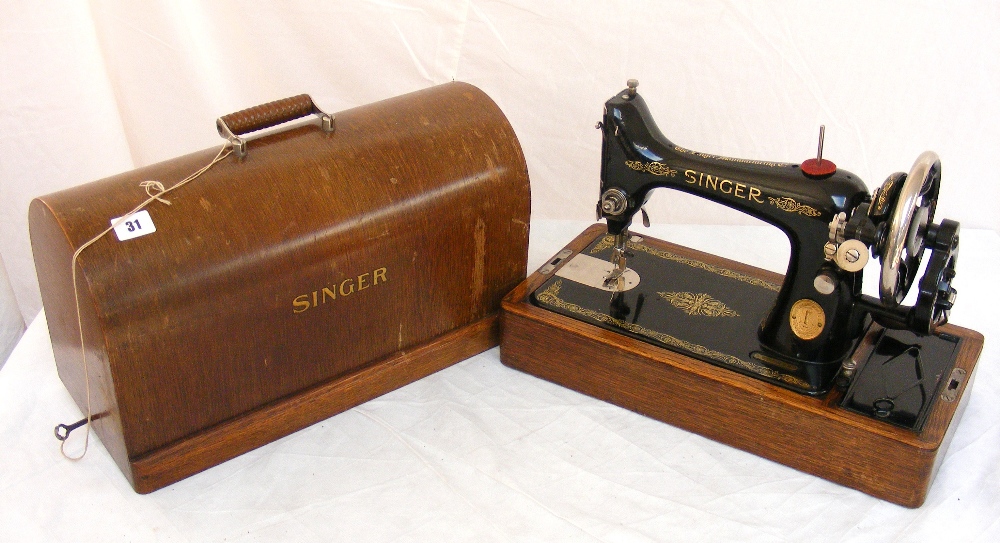 A vintage Singer sewing machine in case