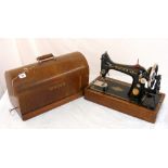 A vintage Singer sewing machine in case