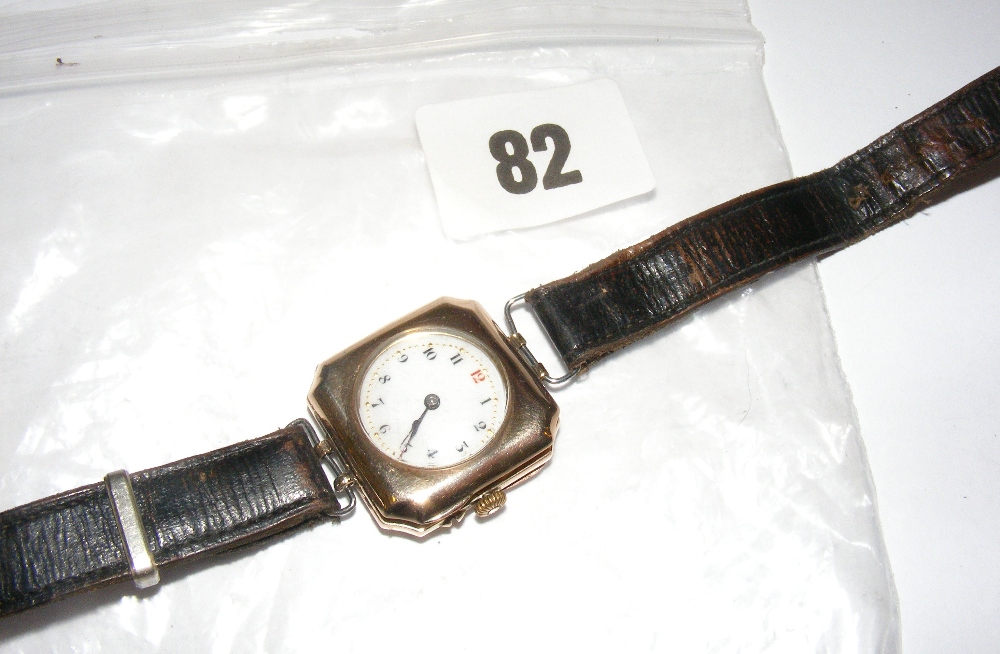 A 9ct gold wristwatch on leather straps, the dial in enamel and encrusted with jewels. CONDITION