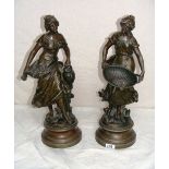 A pair of spelter statues in the form of a man & lady signed by Francois Moreau, each entitled "La