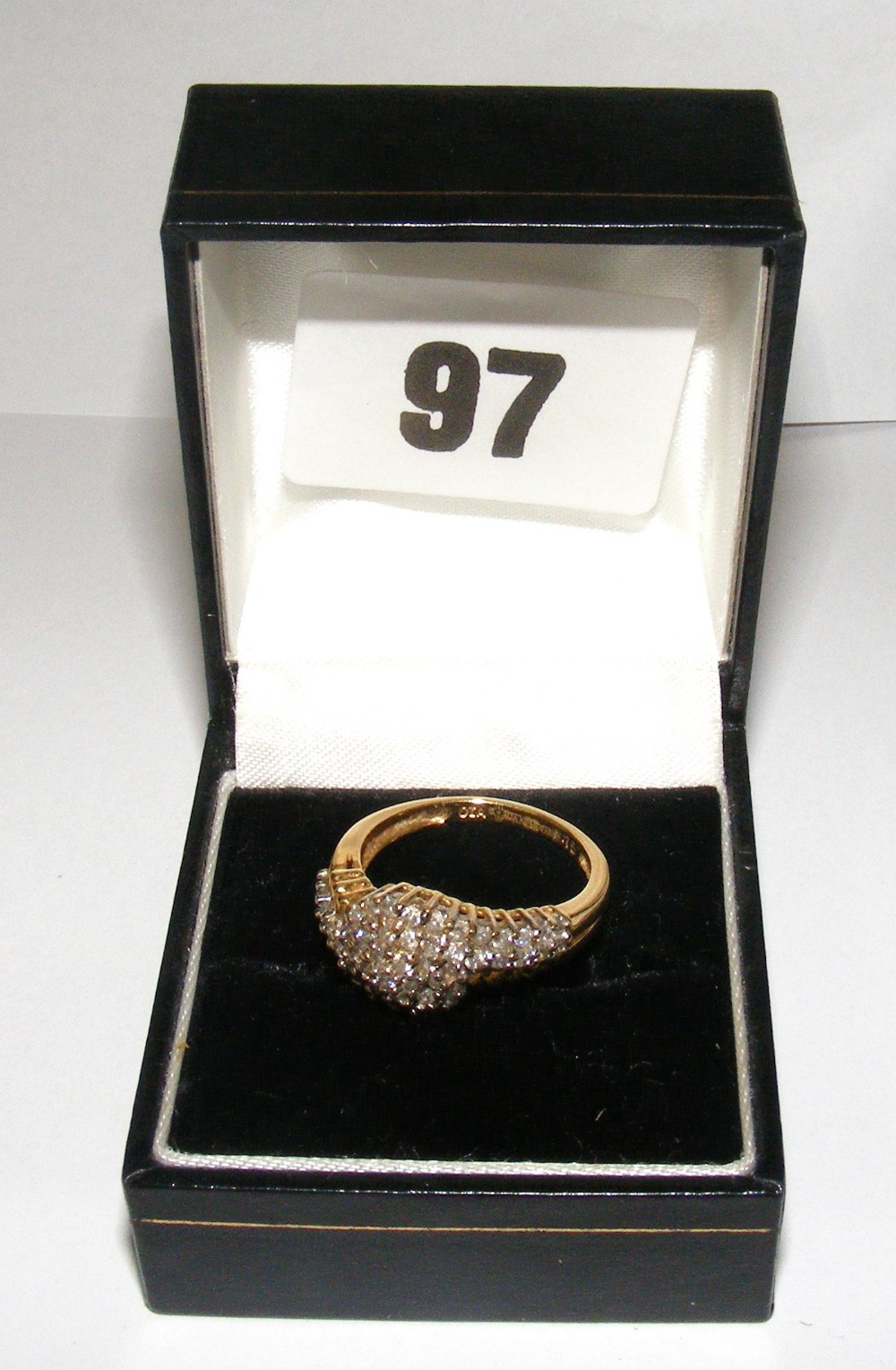 An 18ct gold scroll style ring set with