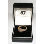 An 18ct gold scroll style ring set with