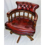 A red leather captains chair.