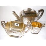 A sterling silver three piece tea service hallmarked for Sheffield 1894 cast with flowers, total