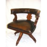 A brown leather swivel Captains chair.. CONDITION REPORT: Good condition
