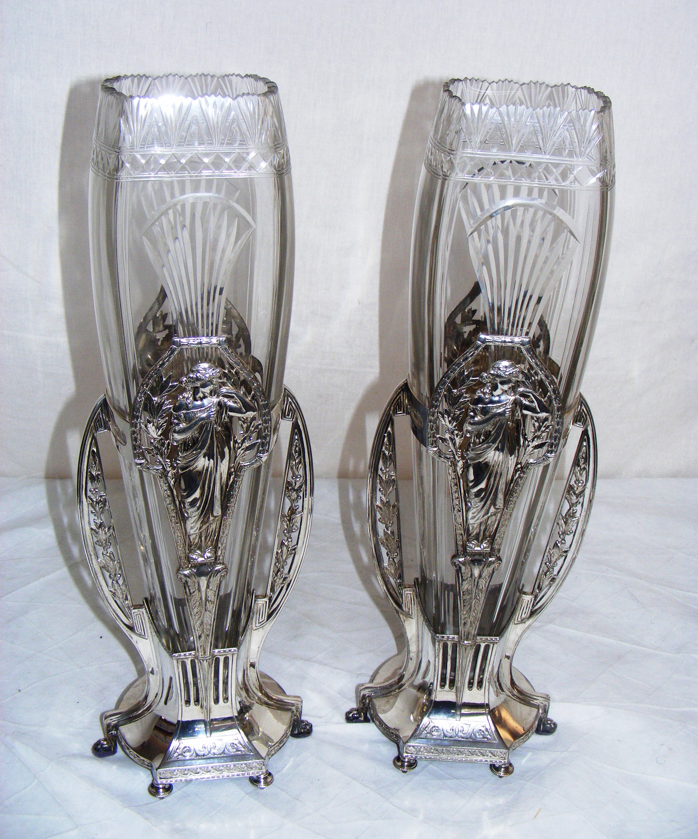 A tall pair of WMF style Art Nouveau silver plated & glass vases. Each 47cm tall. With number to