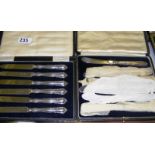 Two cased sets of sterling silver handled tea knives, both hallmarked for Sheffield.