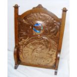 An Arts & Crafts copper fire screen beaten with a fish design in the manner of Newlyn, Liberty & Co,