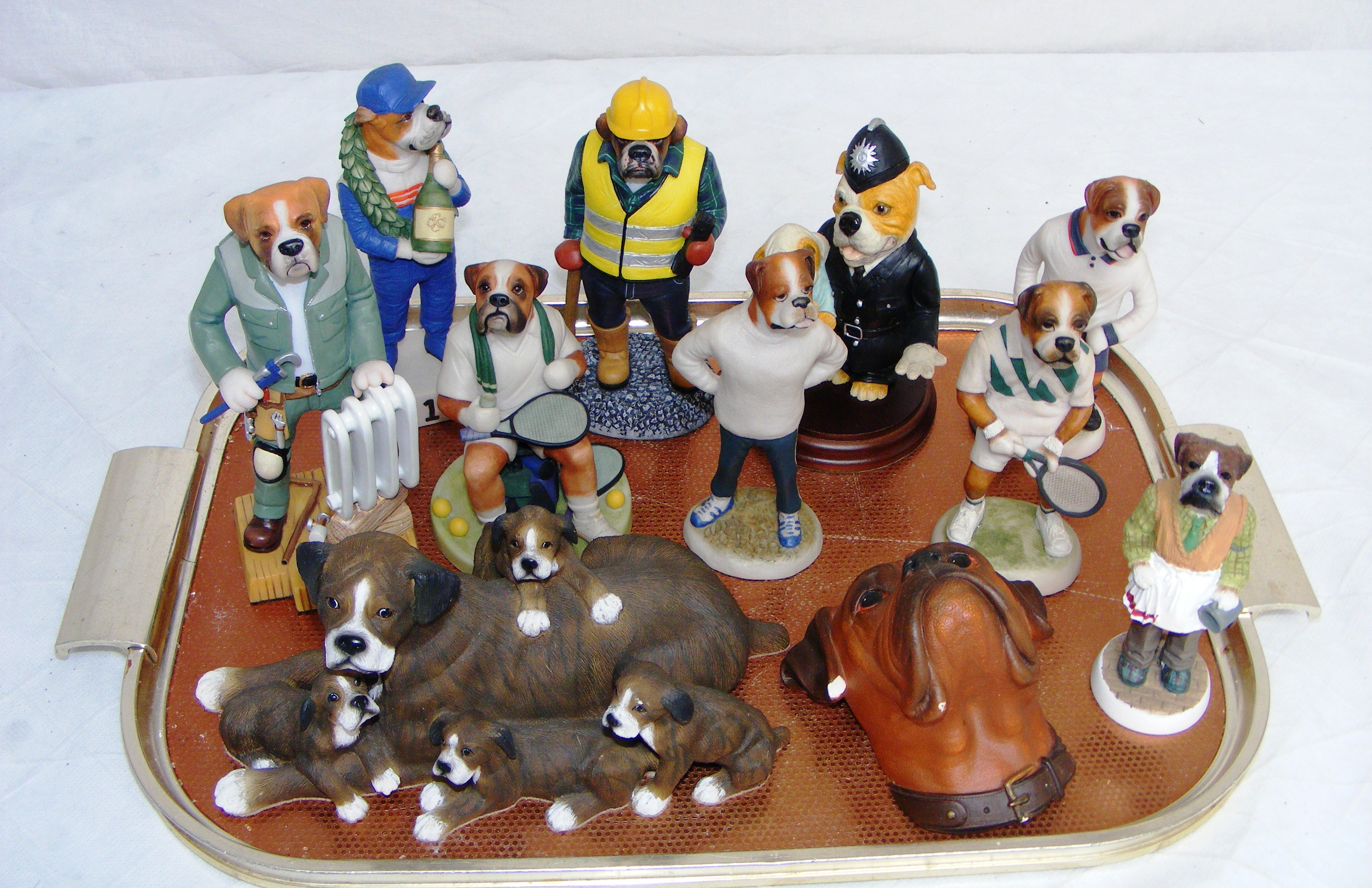 A selection of pottery boxer dogs including Country Companions, Regency Fine Arts, Robbie Harrop,